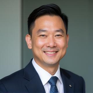 Professional headshot of David Chen, Lead Detailing Instructor - a man smiling confidently